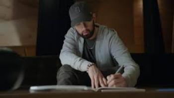 Stans: Eminem writing something.
