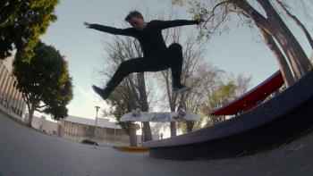 Skateboard pro Leo Baker flipping skateboard. 