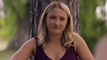 Stolen Baby: The Murder of Heidi Broussard: Emily Osment in a sleeveless top, sitting outdoors by a tree.