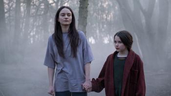Stopmotion Movie: Ella (Aisling Franciosi) walks hand-in-hand with a little girl (Caoilinn Springall) through a foggy wood