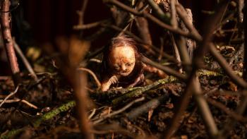 Stopmotion Movie: An unsettling puppet/figure made out of wax seems to crawl through a miniature woods