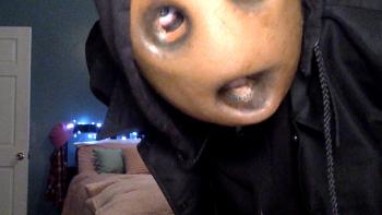 Strange Harvest Movie: In a teen's bedroom, the killer pokes his creepy masked face into a still-running webcam