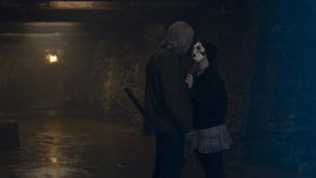 The Strangers: Chapter 3 Movie: "Scarecrow," holding an axe, and "Pin-Up Girl" get close together after a killing