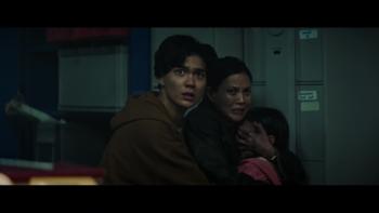 Sunrise: Crystal Yu, William Gao, and Riley Chung huddle together in the darkness looking scared.