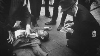 Sunset Boulevard movie: A man lies dead on the ground as police surround him