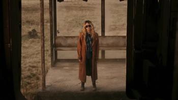 Supergirl Movie: Milly Alcock waits at an abandoned bus station