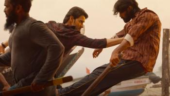 Sarkaru Vaari Paata: A young Indian man powerfully pushes away another man during a fight scene