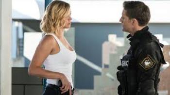 S.W.A.T.: Under Siege: man and woman have conversation