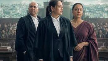 System movie: Courtroom scene with three people, two in robes, standing resolutely.