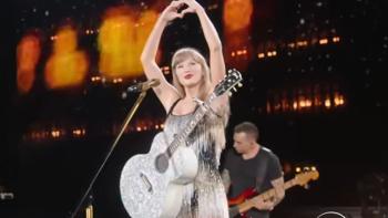 Taylor Swift: The Eras Tour –  The Final Show: Swift sings with a guitar.
