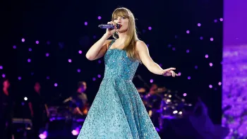 Taylor Swift: The Eras Tour –  The Final Show: Swift in blue dress.