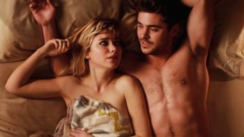 That Awkward Moment Movie: A couple lies in bed, implied naked under bedsheets