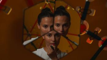 The Assessment movie: Alicia Vikander looks in a mirror that gives her three split images