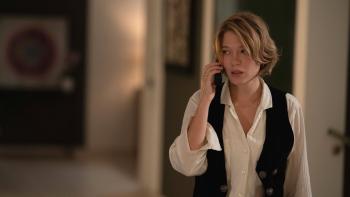 The Beast: Léa Seydoux holds a phone to her ear inside a modern home