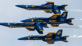 The Blue Angels: Jets flying into diamond formation.