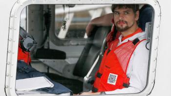 The Carman Family Deaths movie: Nathan Carman in orange vest pictured sitting in a rescue helicopter