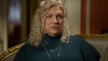 The Carman Family Deaths movie: White woman with blond hair in turquoise sweater and necklace center sits down for an interview