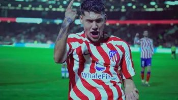 The Champion movie: Spanish man in Athletico Madrid jersey celebrates on the pitch in a stadium