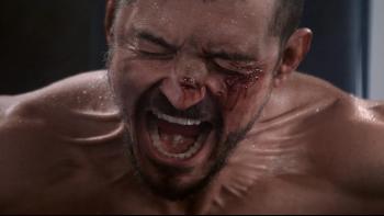 The Cut: A male boxer shouts with a cut eye during a fight