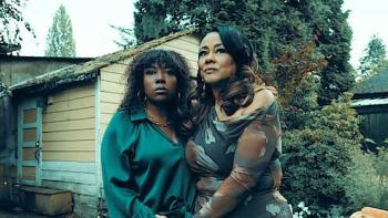 The Dating App Killer: The Monica White Story: Two women standing together outside, embracing, with a shed and trees behind them.