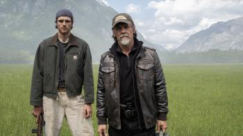 The Dog Stars movie: Jacob Elordi holds a rifle and Josh Brolin holds a gas can, standing in front of mountains