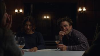The Drama movie: Sitting with another couple drinking wine, Zendaya looks shocked while Robert Pattison smiles impishly