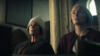The Dreadful: Marcia Gay Harden and Sophie Turner stand next to each other in church, looking serious