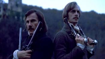 The Duellists: Harvey Keitel and Keith Crradine stand with pistols.