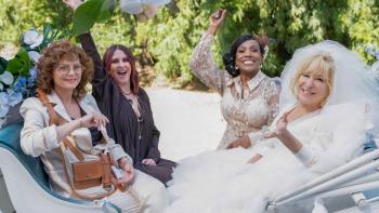 The Fabulous Four movie: Susan Sarandon, Megan Mullally, Sheryl Lee Ralph, and Bette Midler sit together at a wedding
