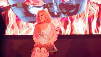 The Fabulous Four Movie: Bette Midler smiles while sitting on a stage wearing a sash that says "Bride"