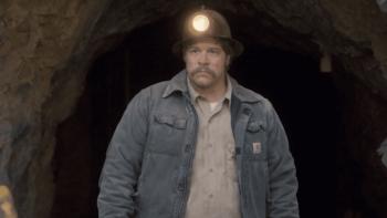 The Faith of Angels Movie: John Michael Finley walks out of a cave wearing a miner's helmet