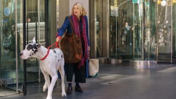 The Friend movie: Naomi Watts leaves a New York apartment building with a Great Dane pulling at its leash