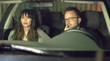 The Get Out: A man and woman sitting in a car at night, looking serious