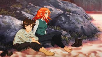 The Glassworker movie: Vincent and Alliz sit barefoot on the beach