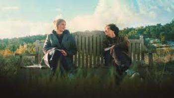 The Heartbreak Agency: two people sit on a bench