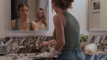 The Housemaid movie: Nina (Amanda Seyfried) looks at Millie  (Sydney Sweeney) in the mirror as Millie cleans