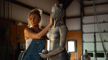 The Huntsman movie: Elizabeth Mitchell works on a sculpture of a nude woman