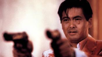 The Killer: A blood-covered Chow Yun-Fat holds two pistols