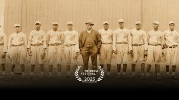 The League Movie: Rube Foster wearing a suit in front of his baseball team, the Chicago American Giants