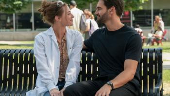 The Love Hypothesis: Lili Reinhart and Tom Bateman on a bench.