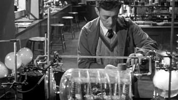 The Man in the White Suit: Alec Guinness working in a laboratory