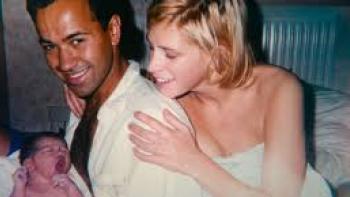The Murder of Rachel Nickell: Couple smiling with newborn baby in a cozy room.