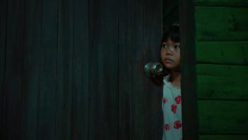 The Murderer movie: Thai girl right peeks through door crack in dark room