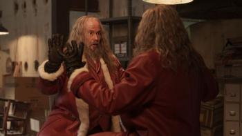 The Night My Dad Saved Christmas 2: A Santa stares at his look alike in front of him
