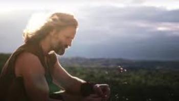 The Oath Movie: Darin Scott stands on a hill looking out in the distance