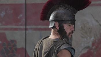 The Odyssey movie: Odysseus (Matt Damon)  stands in side profile with a helmet on