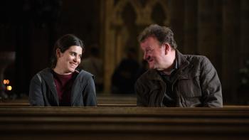 The Old Oak: Ebla Mari and Dave Turner smile at each other as they sit on a church pew