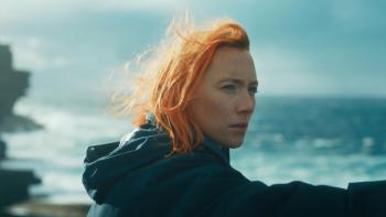 The Outrun: Saoirse Ronan looks out to sea, her bright orange hair blowing in the wind