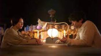 The Parades: group sits around light