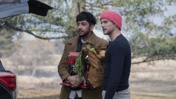 The Parenting: Nik Dodani and Brandon Flynn by a car.